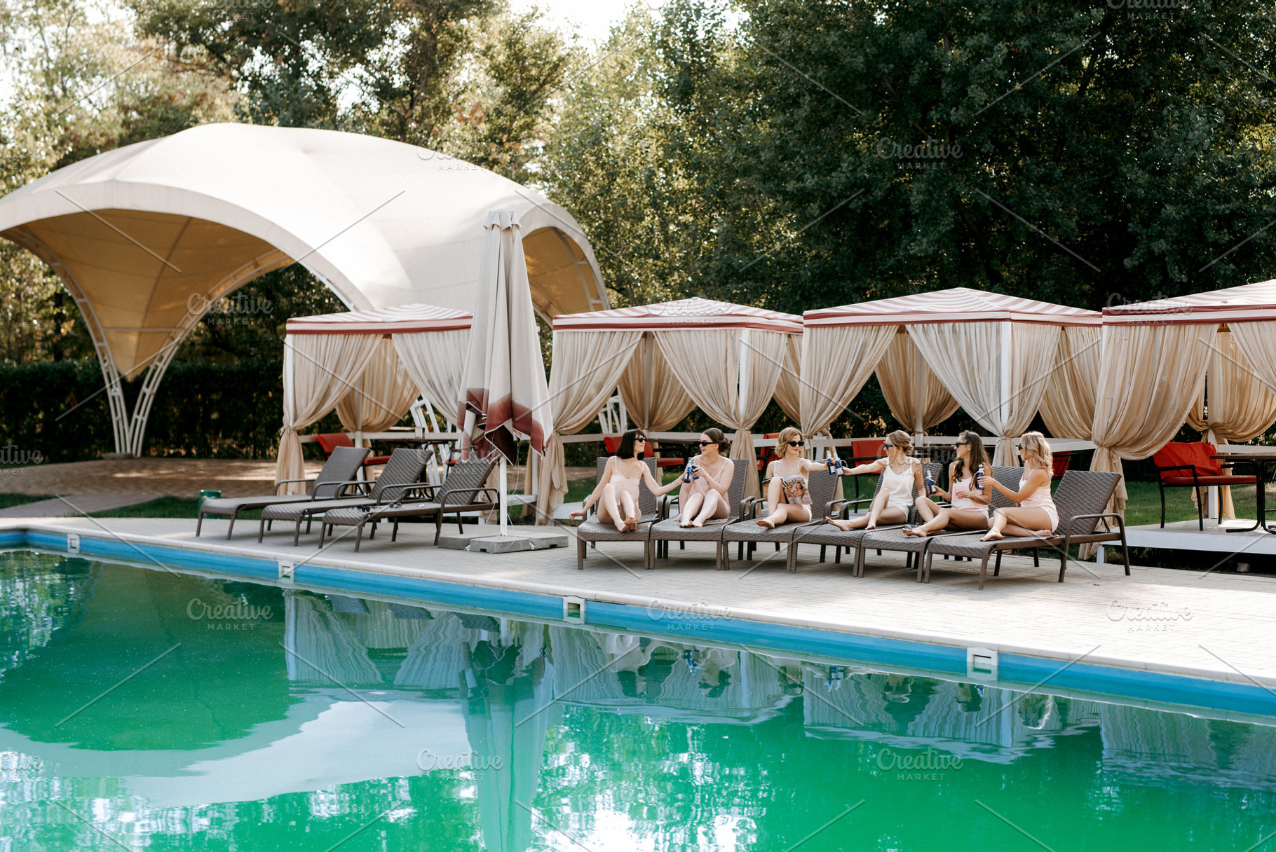 young girls relaxing near the pool, a Person Photo by Weddings, People, Travel