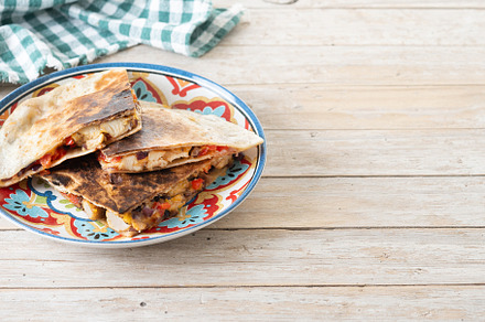 Mexican chicken quesadillas with cheese and peppers on wooden ta, a Food & Drink Photo by etorres69