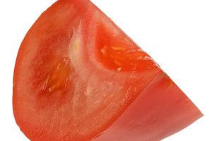 Juicy ripe slice of red tomato with seeds inside, isolated backg, a Food & Drink Photo by ndanko