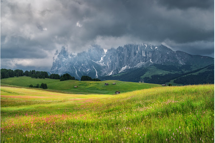 Dramatic sky over Alpe di Siusi with, a Nature Photo by den-belitsky