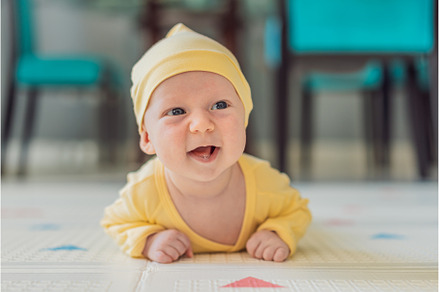 One-month-old baby lying on tummy, a Person Photo by Elizaveta Galitskaya