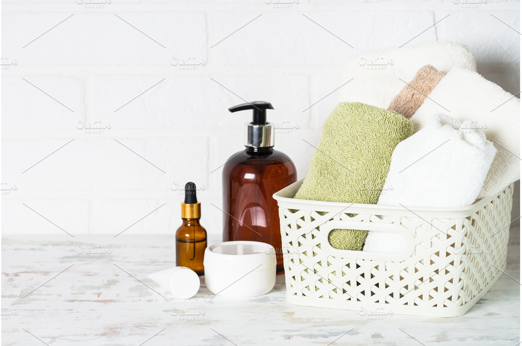 Bottle of soap and stack of towels, a Health & Medical Photo by Nadia-nb