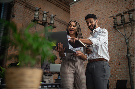 Cheerful young businesspeople with, a Person Photo by HalfPoint