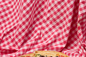 Pizza with cheese, tomatoes and olives on a white plate standing, a Food & Drink Photo by ndanko