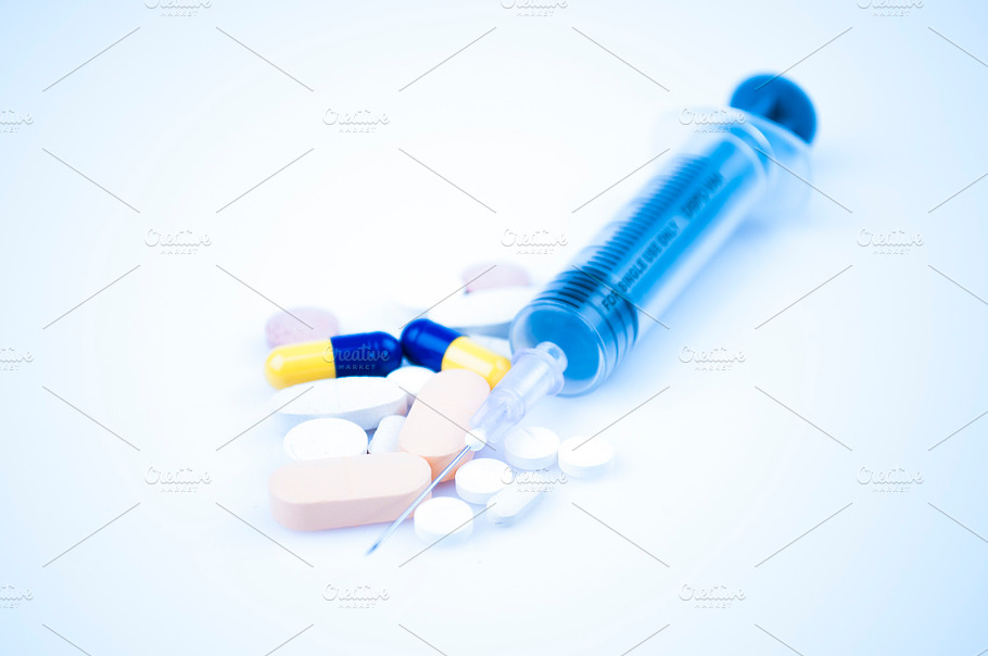 Syringe On Blue