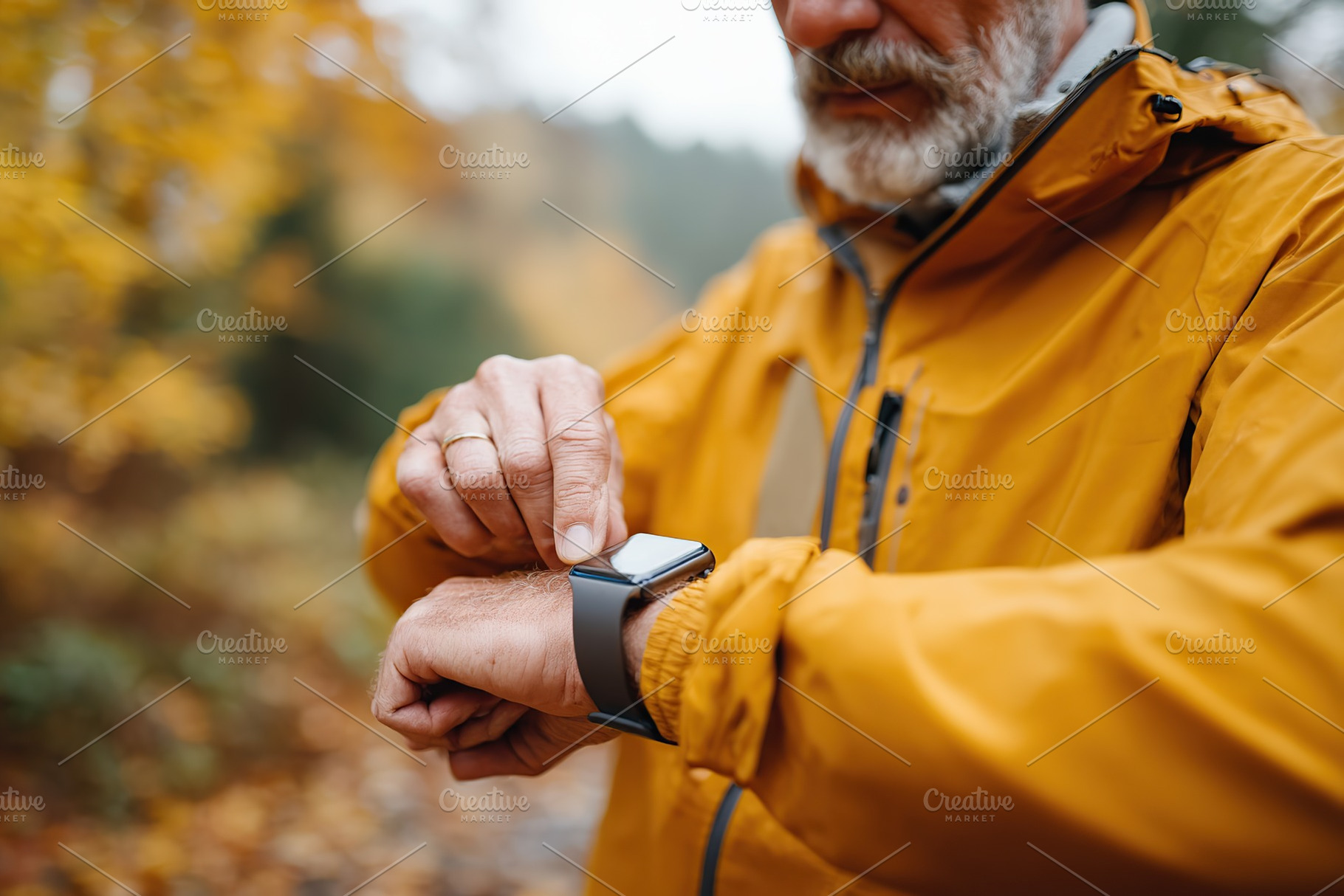 Elderly man in smart jacket checking smartwatch during fall season walk in natu, a Photo by AlyaAnd