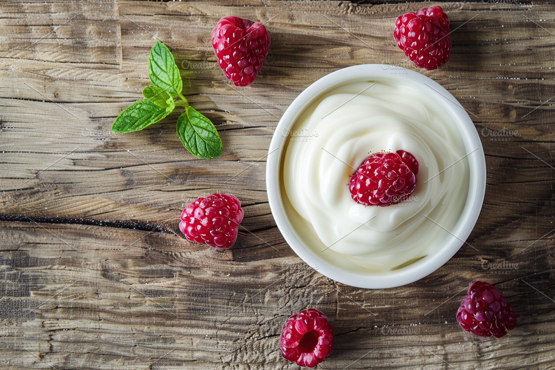 Bowl with fresh raspberries and yogurt on wooden table, a Food & Drink Photo by AlyaAnd