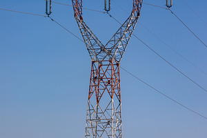 Steel electricity pylon standing in a green field under a clear blue sky, symbo, a Technology Photo by Ales Munt