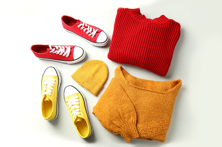 Sweaters, sneakers and knitted hat on white background, a Beauty & Fashion Photo by AtlasStudio