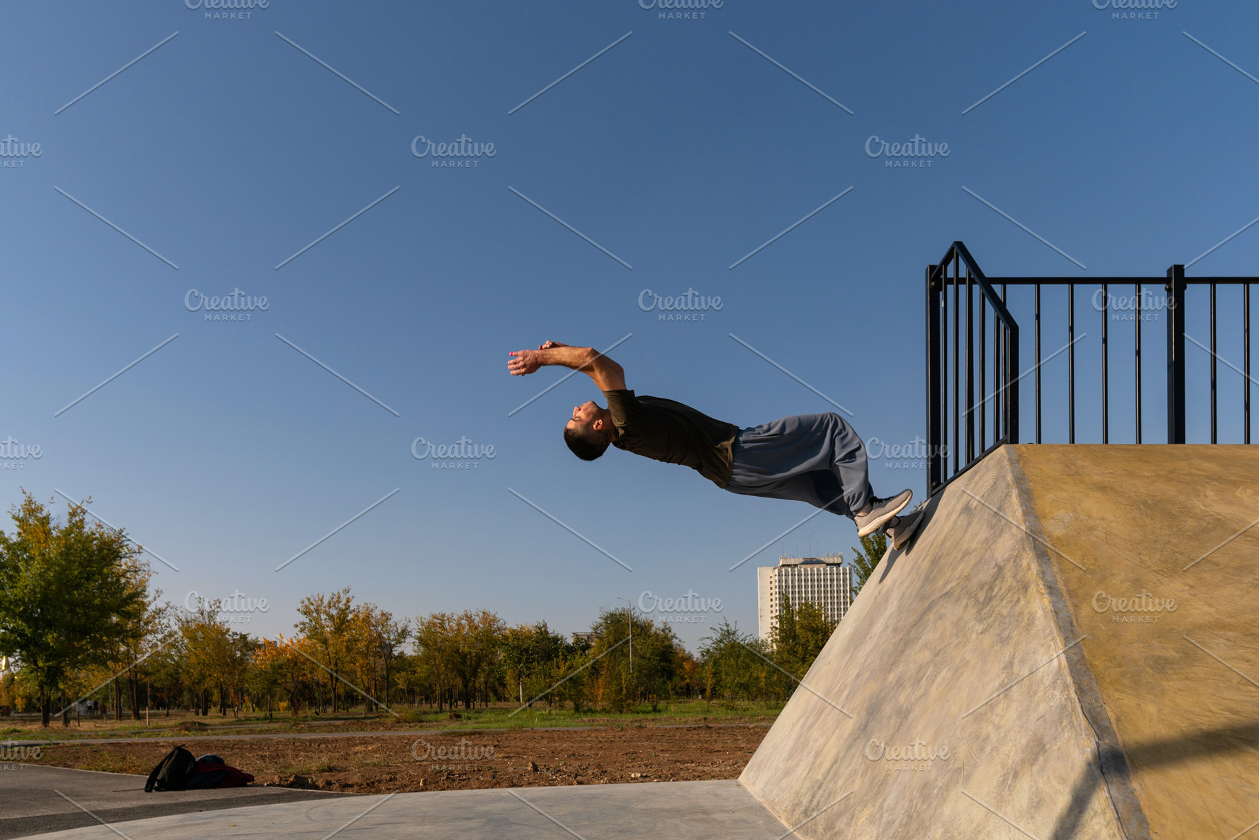 Man performing backflip off concrete, a Sports & Recreation Photo by Elena Vagengeim