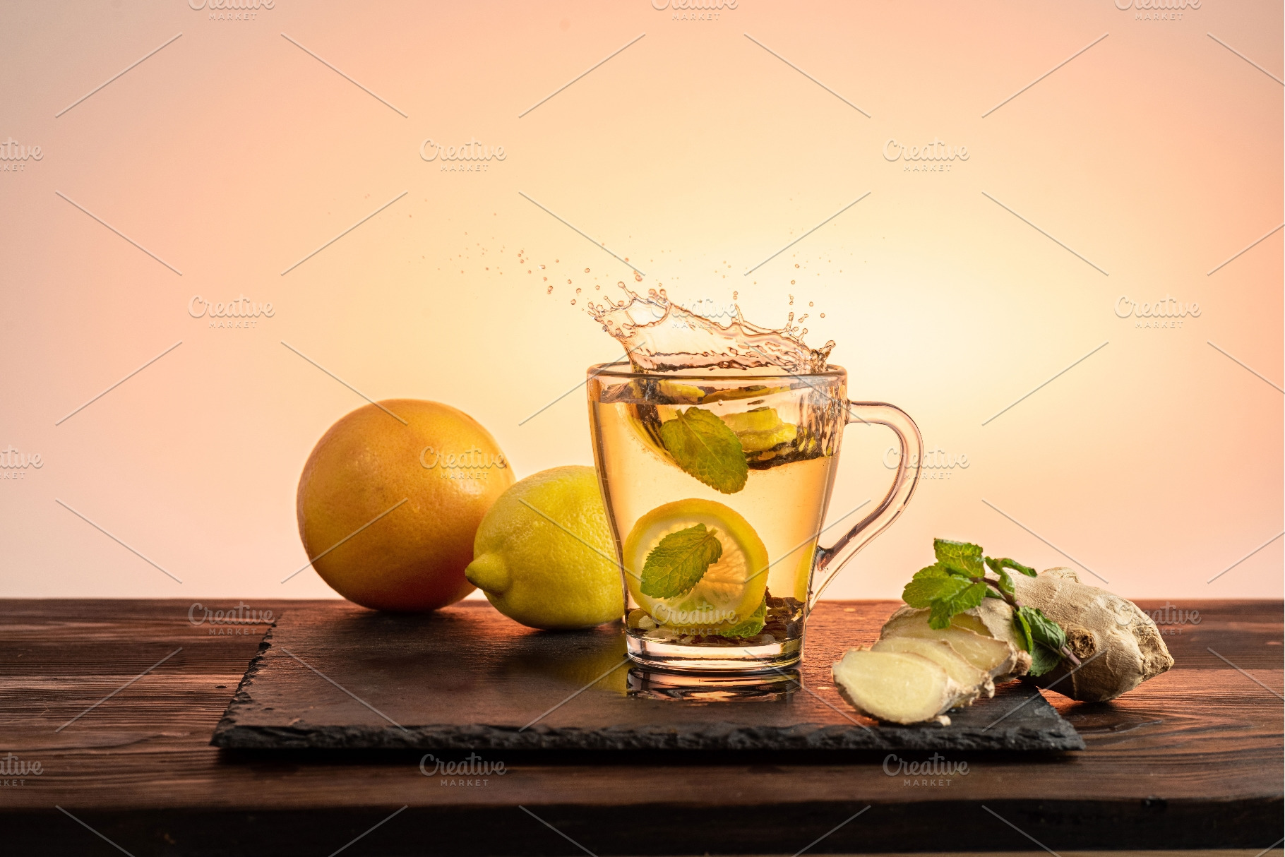 Glass cup with lemon, mint, and, a Food & Drink Photo by Stockphoto by vzwer