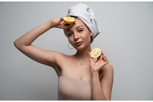 Young woman with a towel wrapped, a Health & Medical Photo by volodymyrshtun13795
