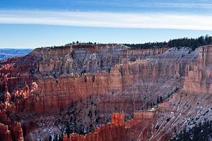 Stunning red hoodoo canyon in Utah with blue sky and snow-dusted formations, a Nature Photo by AS photostudio