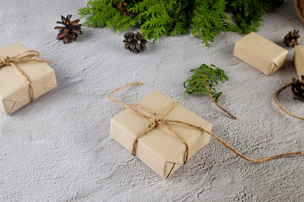 Christmas still life. Xmas Gift in craft paper with pine cones,, a Holiday Photo by vimart