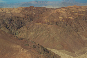Aerial view of desert canyons and Andes mountain range, terracot, a Photo by Pictures for you!!!!!!!!!