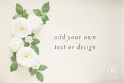 Flat Lay Photo with White Flowers, a Product Mockup by Banter Design Co. (Thumbnail 1 of 2)