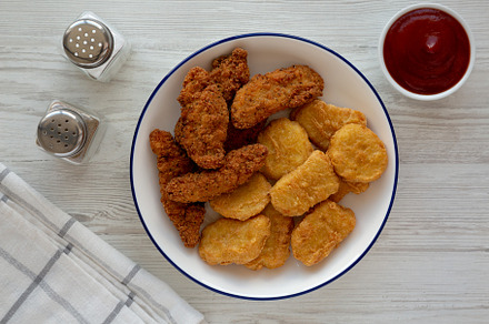 Homemade Chicken Strips and Nuggets with Ketchup, a Food & Drink Photo by LiudmylaChuhunova