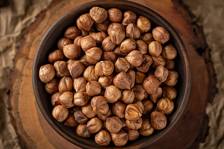 Roasted hazelnuts piled in a bowl