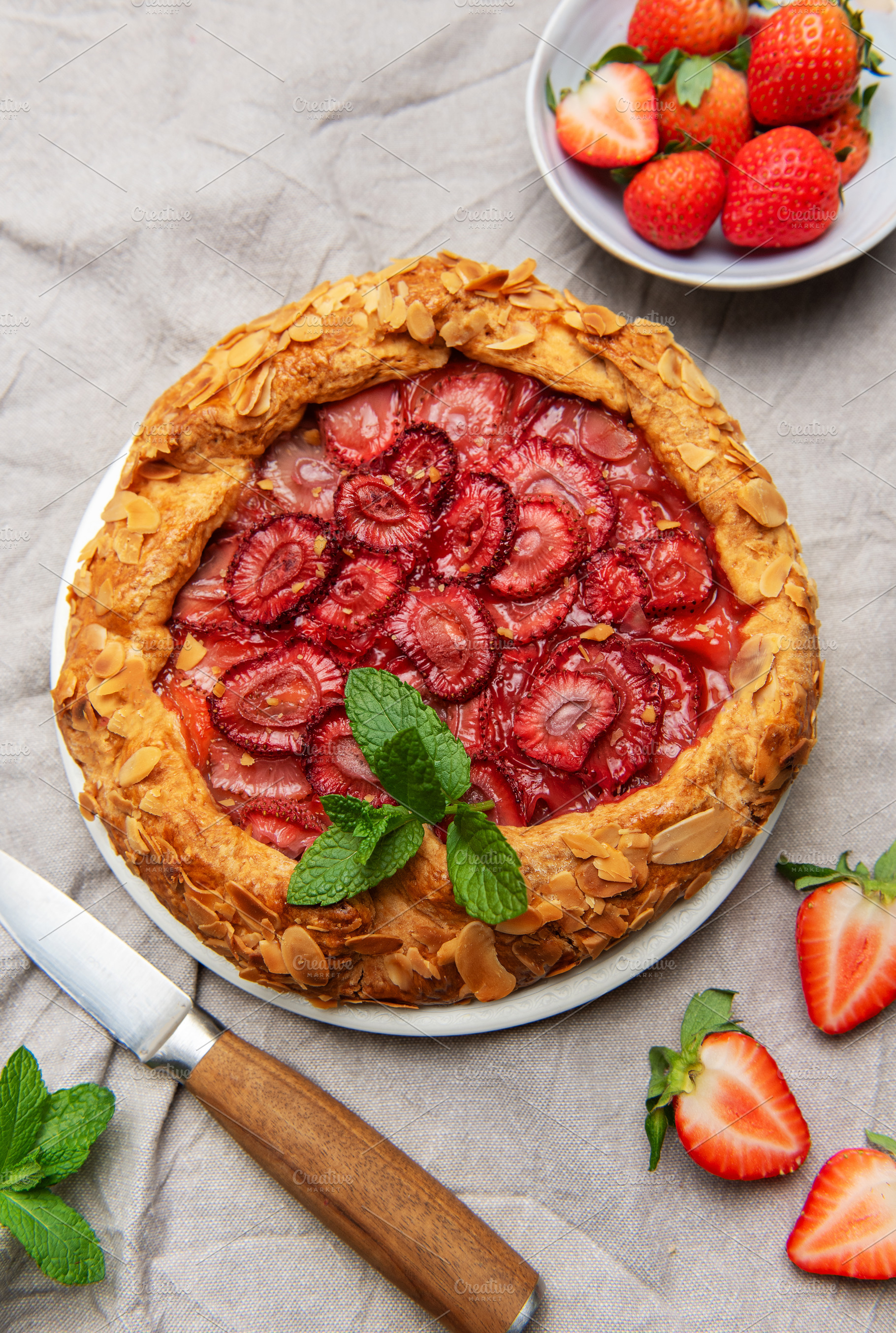 Delicious homemade strawberry galette decorated with almond peta, a Food & Drink Photo by Olena Rudo