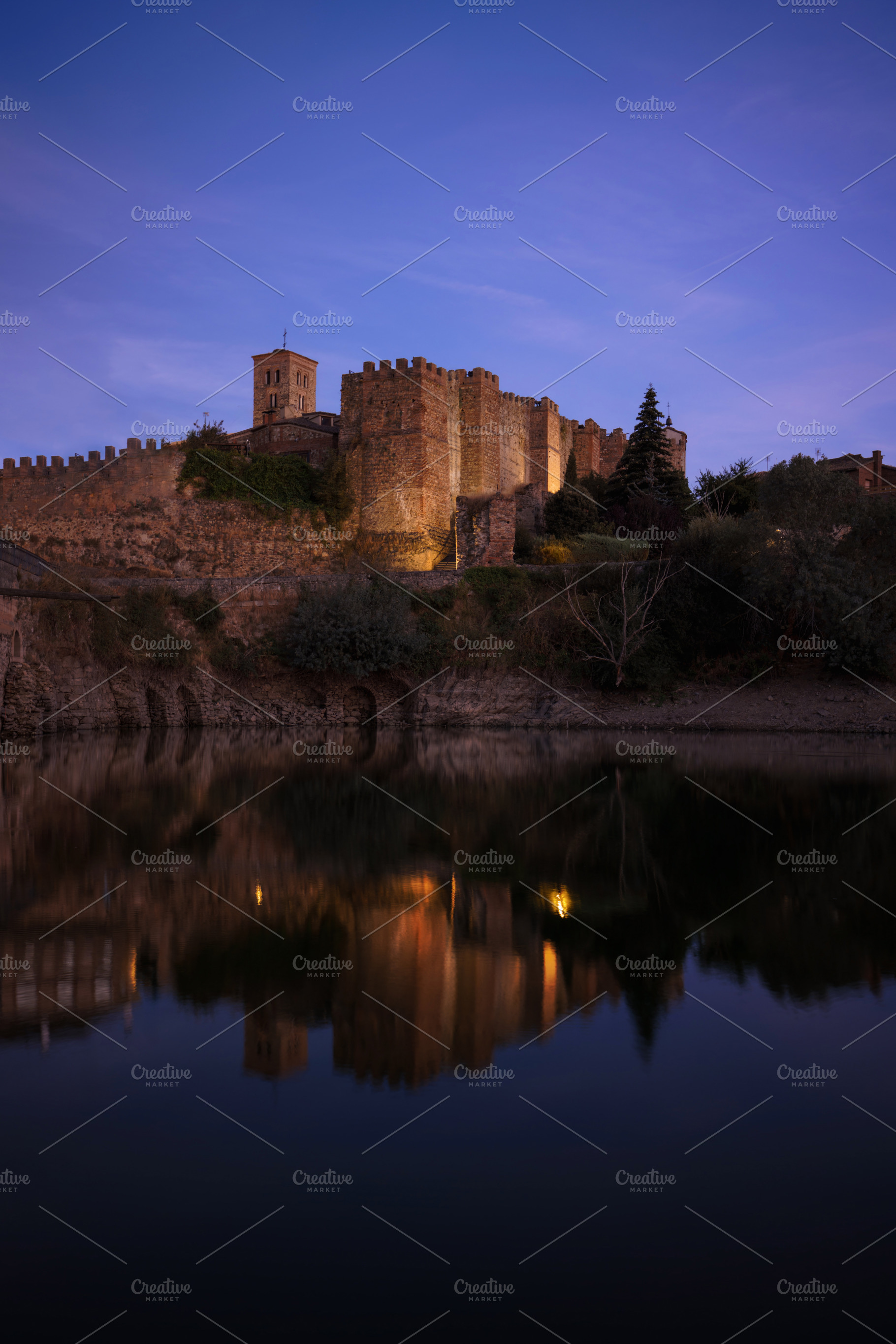 Medieval Castle Illuminated at Sunse, an Architecture Photo by Perpis