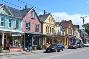 Storefronts brighten charming street, a Photo by Pavel_design