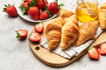 Delicious french croissants with fresh strawberries and honey fo, a Food & Drink Photo by Olena Rudo