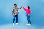 Joyful young African American couple giving high five to each other, celebratin, a Photo by Prostock-Studio (Thumbnail 1 of 2)
