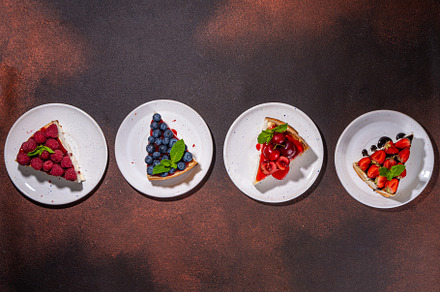 Summer cheesecake slices with various berry, a Food & Drink Photo by Rimma
