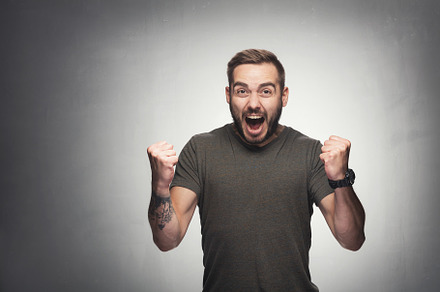 Excited man on grunge background, a Person Photo by Photocreo Michal Bednarek