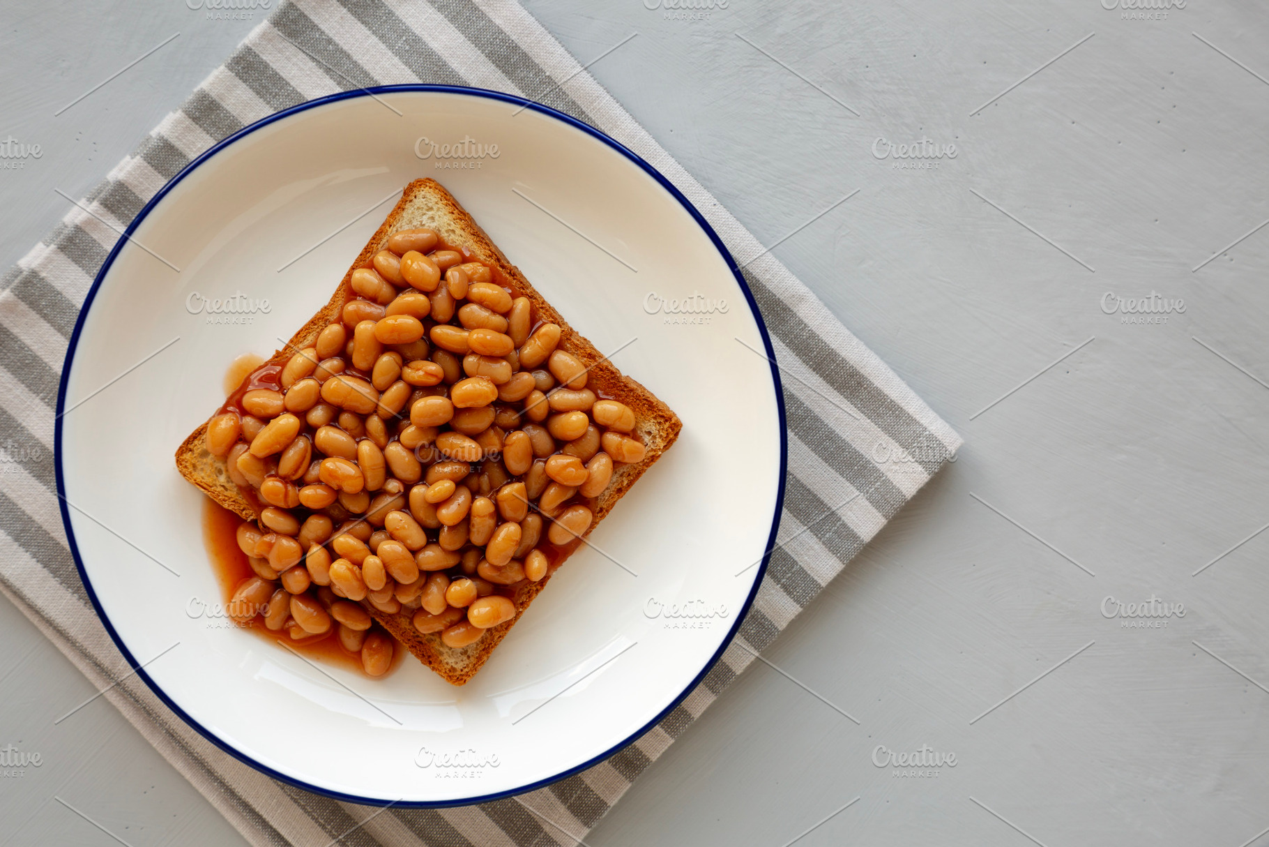 Homemade English Beans on Toast, top view. Copy space., a Food & Drink Photo by LiudmylaChuhunova