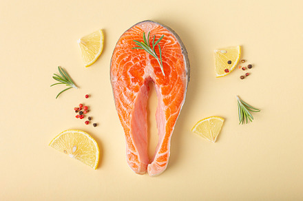 Raw fresh fish salmon steak top view on beige pastel background, a Food & Drink Photo by its_al_dente