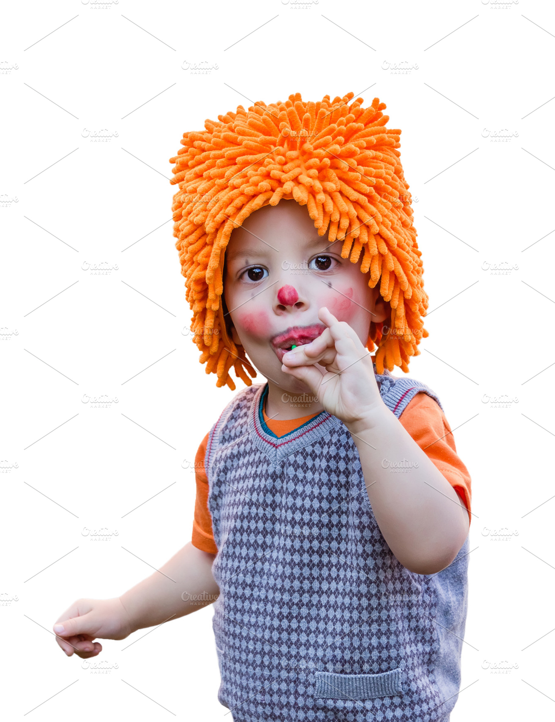Clown child eating a lollipop
