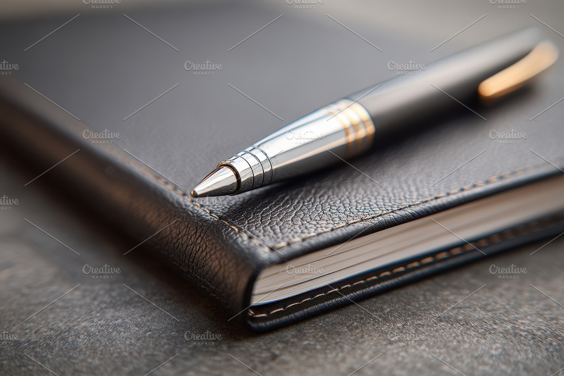 Spiral leather notebook with pen, a Business Photo by AlyaAnd