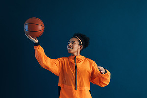 Young woman playing with a basketbal, a Sports & Recreation Photo by Artem Varnitsin
