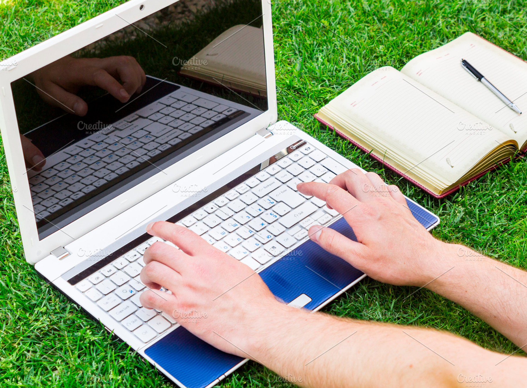 Businessman using a laptop on the grass outdoors green business and, a Business Photo by Life For Photo