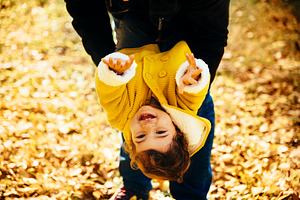 Happy little girl playing in park, a Person Photo by hitdelight