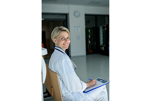 Young female doctor with short hair, a Person Photo by HalfPoint