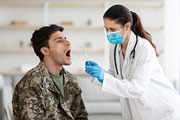 Doctor taking sample for DNA test from soldier in clinic, a Photo by Prostock-Studio (Thumbnail 2 of 4)