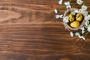 Easter flat lay. Stylish easter eggs in nest and white blossom o, a Holiday Photo by Sonjachni