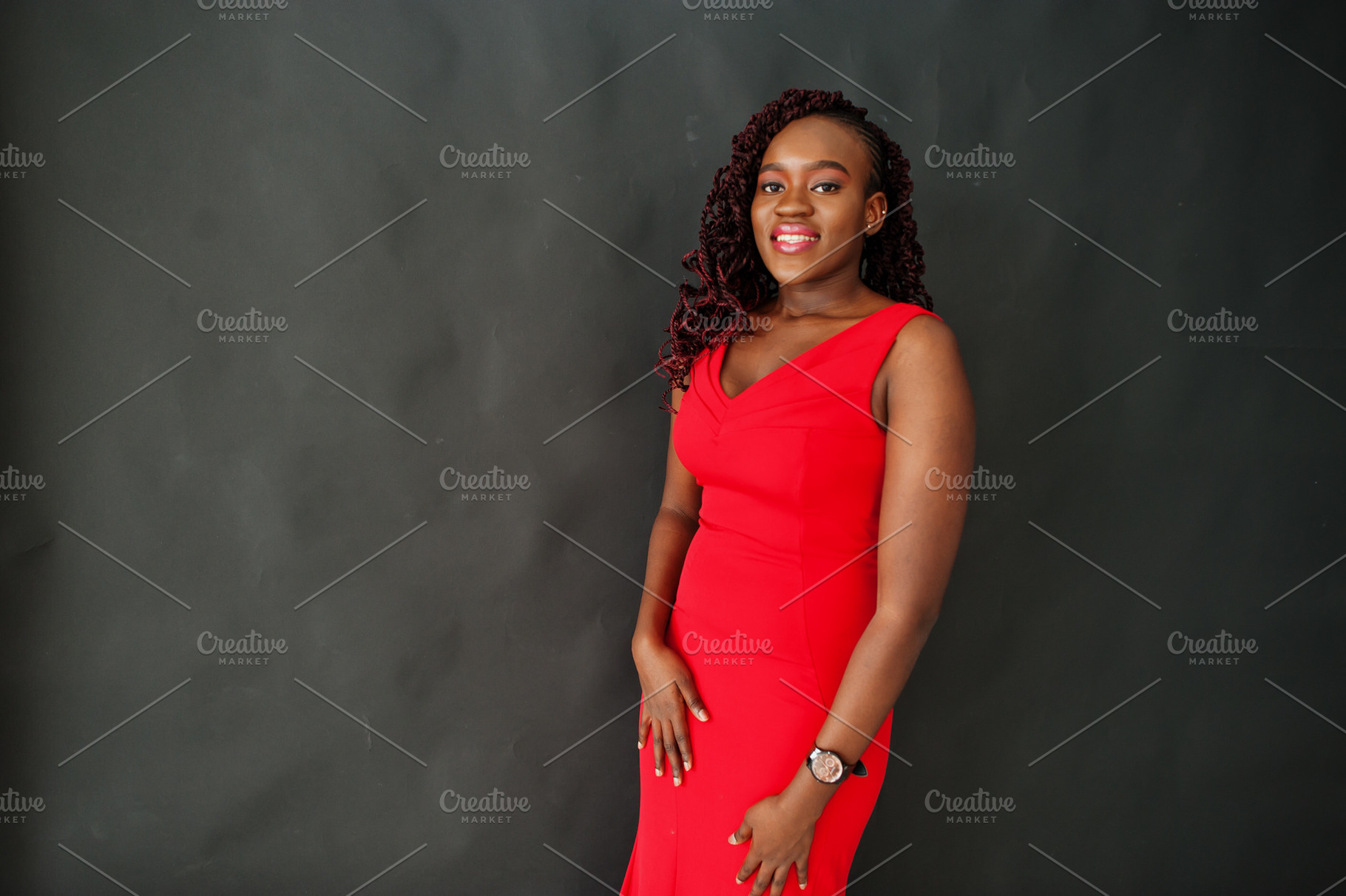 Magnificent young african woman in luxurious red dress against b, a Beauty & Fashion Photo by AS photostudio