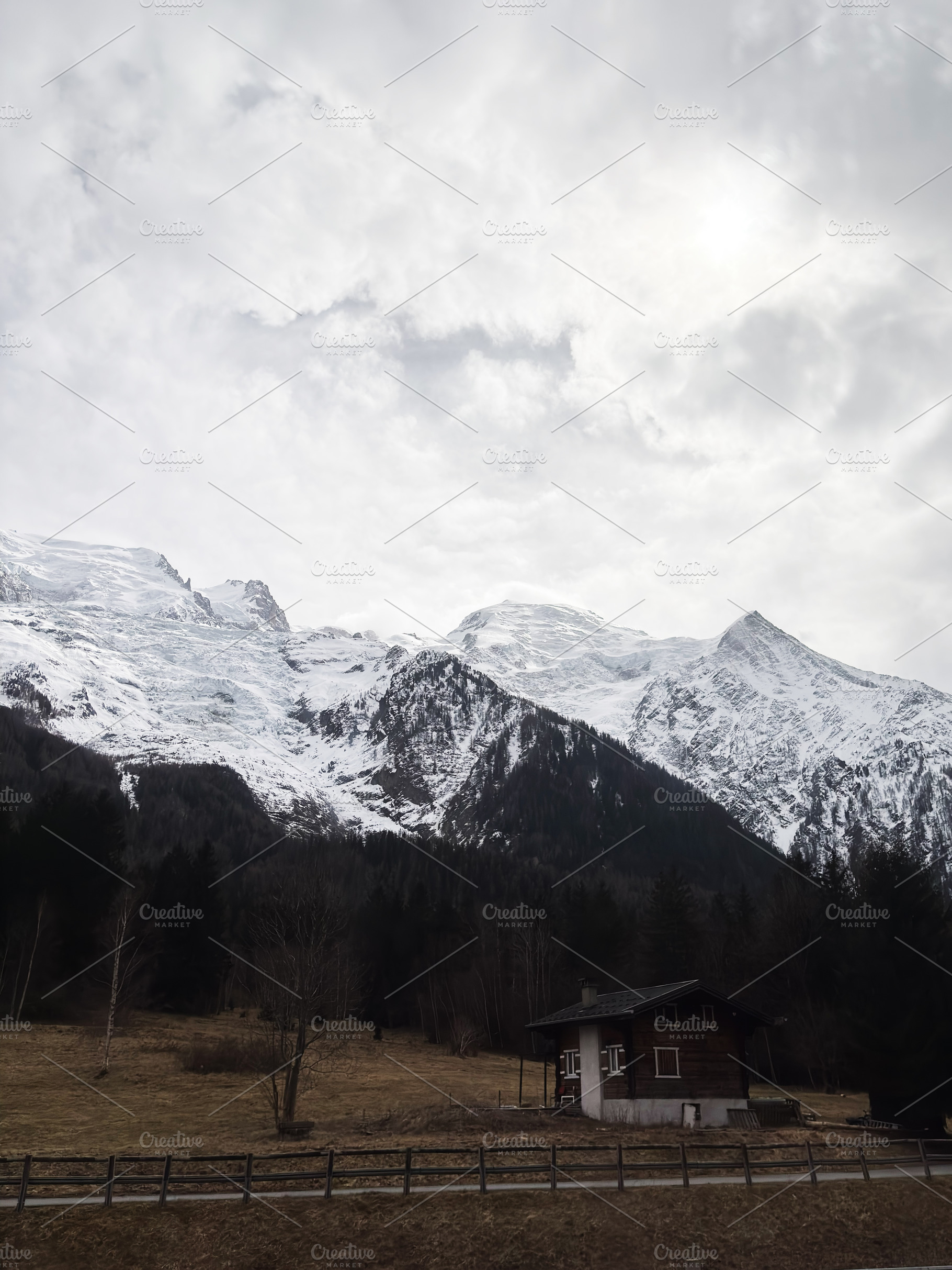 Charming alpine cabin nestled against snowy mountains in a serene Switzerland v, a Photo by AS photostudio