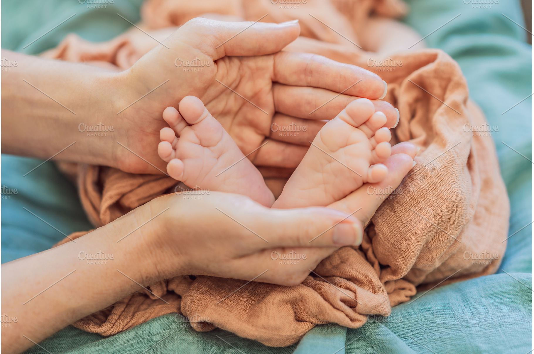 Newborn tiny feet surrounded by, a Person Photo by Elizaveta Galitskaya