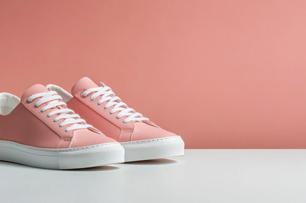 Pink sneakers on color background, a Photo by Dvoevnore photos