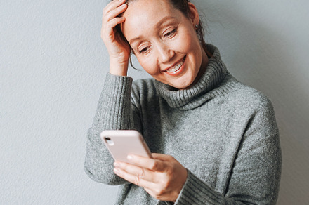 Young adult woman with mobileat home, a Person Photo by Galina_Zhigalova