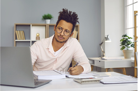 Young indian business man working on, a Person Photo by StudioRomantic