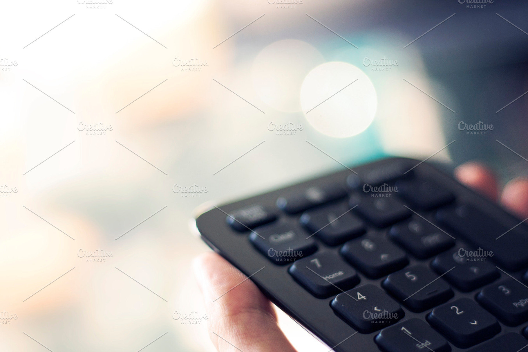 Hands holding calculator keyboard