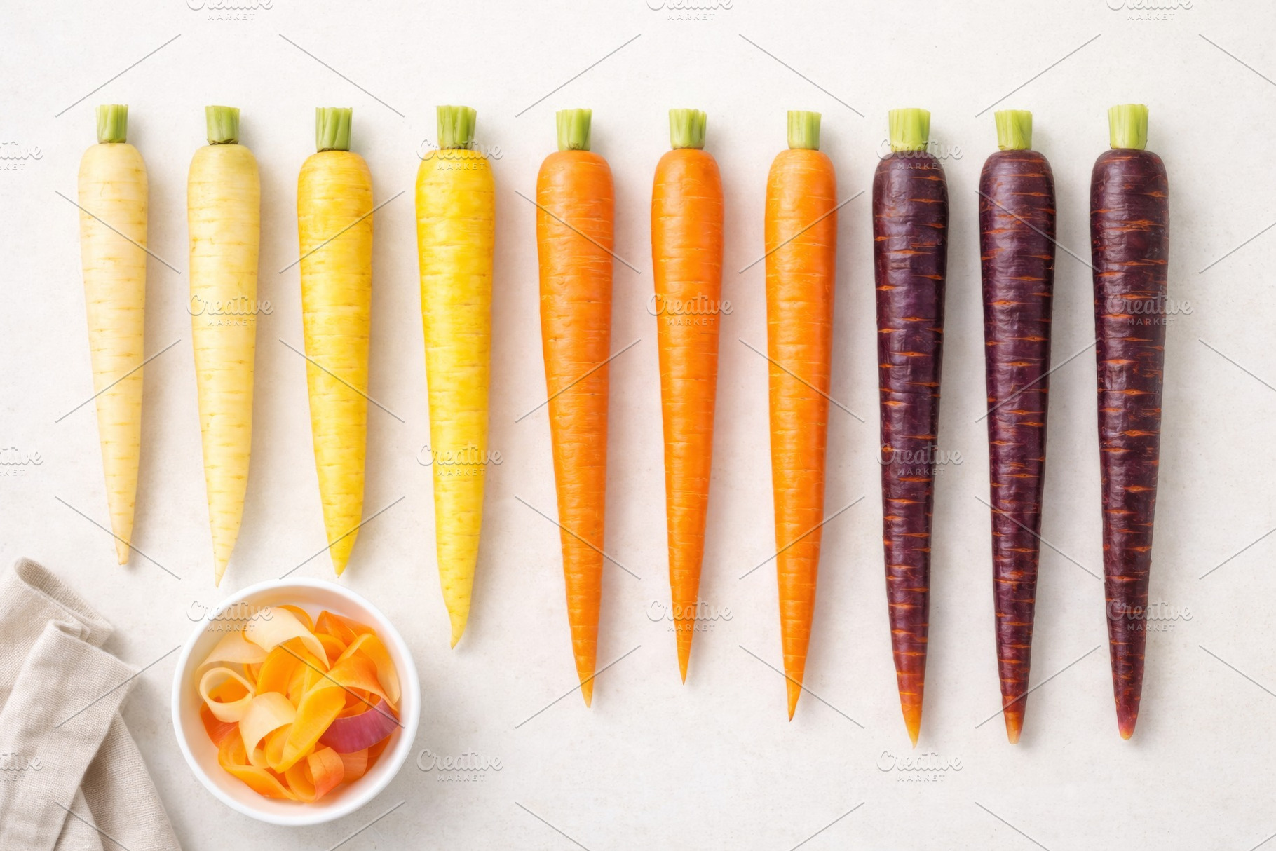 Rainbow carrots arranged in gradient, a Photo by Dvoevnore photos