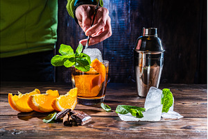 Mixing a cocktail with a bartender's, a Food & Drink Photo by Stockphoto by vzwer