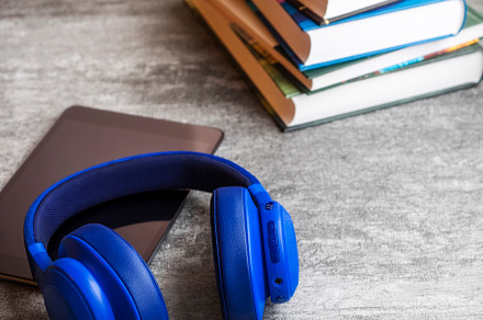 Pile of books with headphones stock photo containing concept and book, a Technology Photo by photoWorkshop