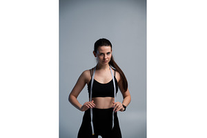 Athletic woman measuring progress, a Sports & Recreation Photo by volodymyrshtun13795